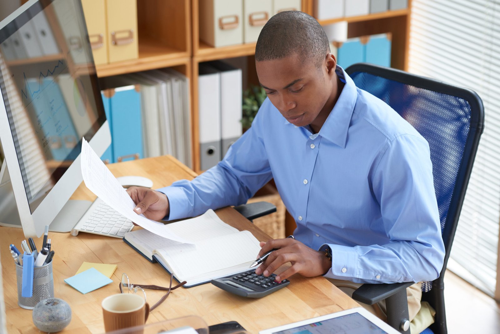 Businessman concentrated on work with financial document